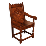 high-backed armchair from the 17th century in oak