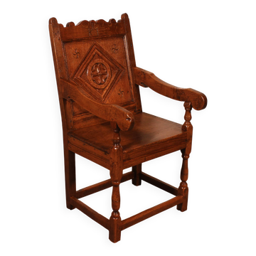 high-backed armchair from the 17th century in oak