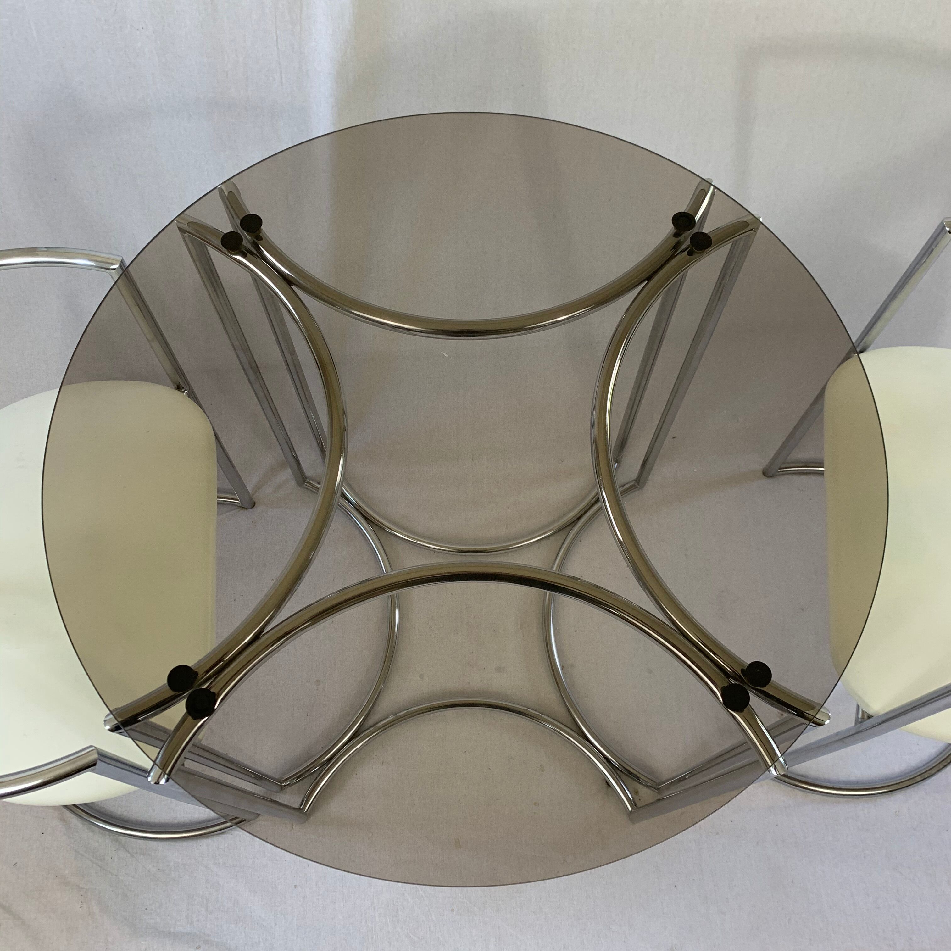 Chrome table and two modernist chairs