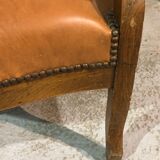 Old Voltaire armchair in light brown leather