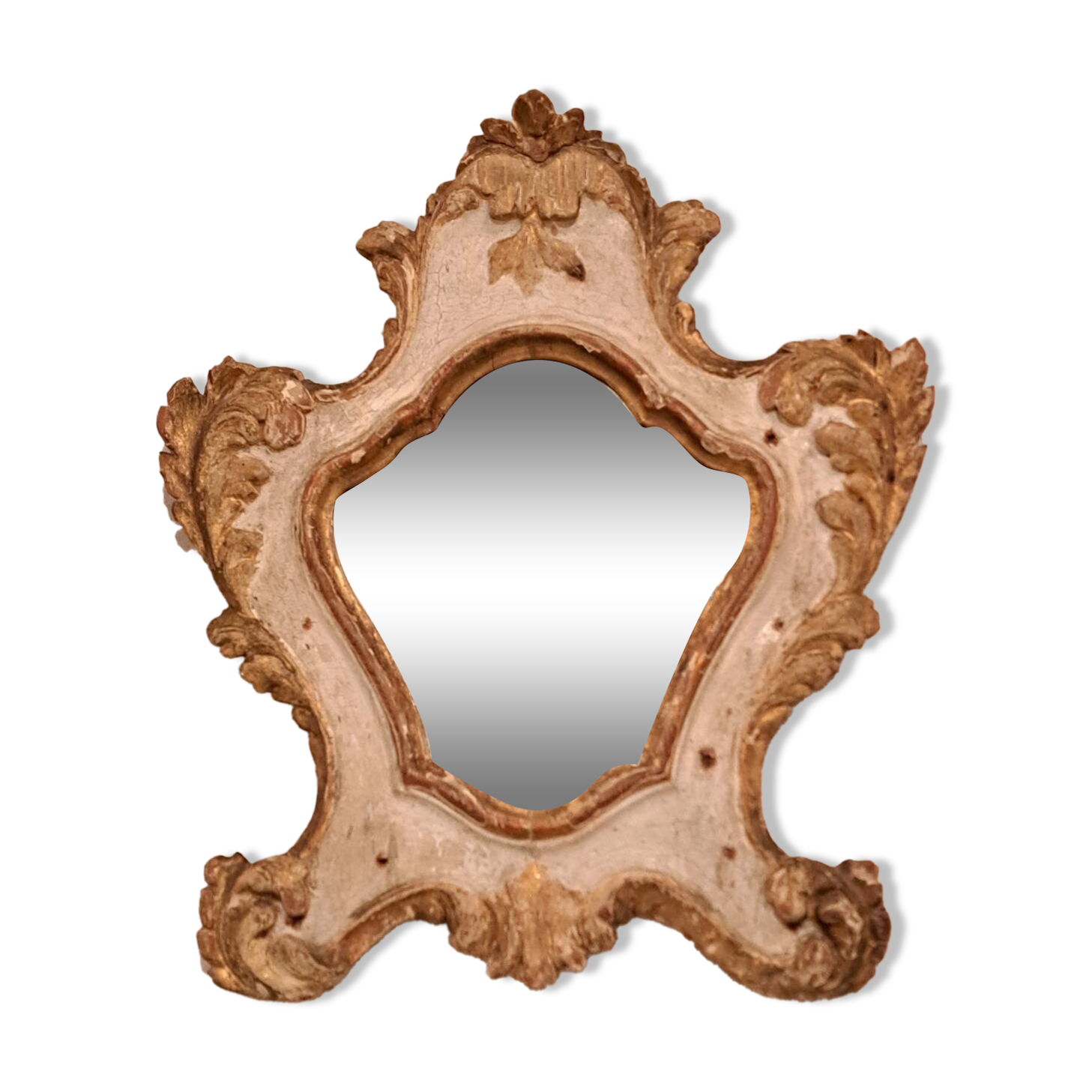 Eighteenth-century Venetian mirror in painted and gilded wood.