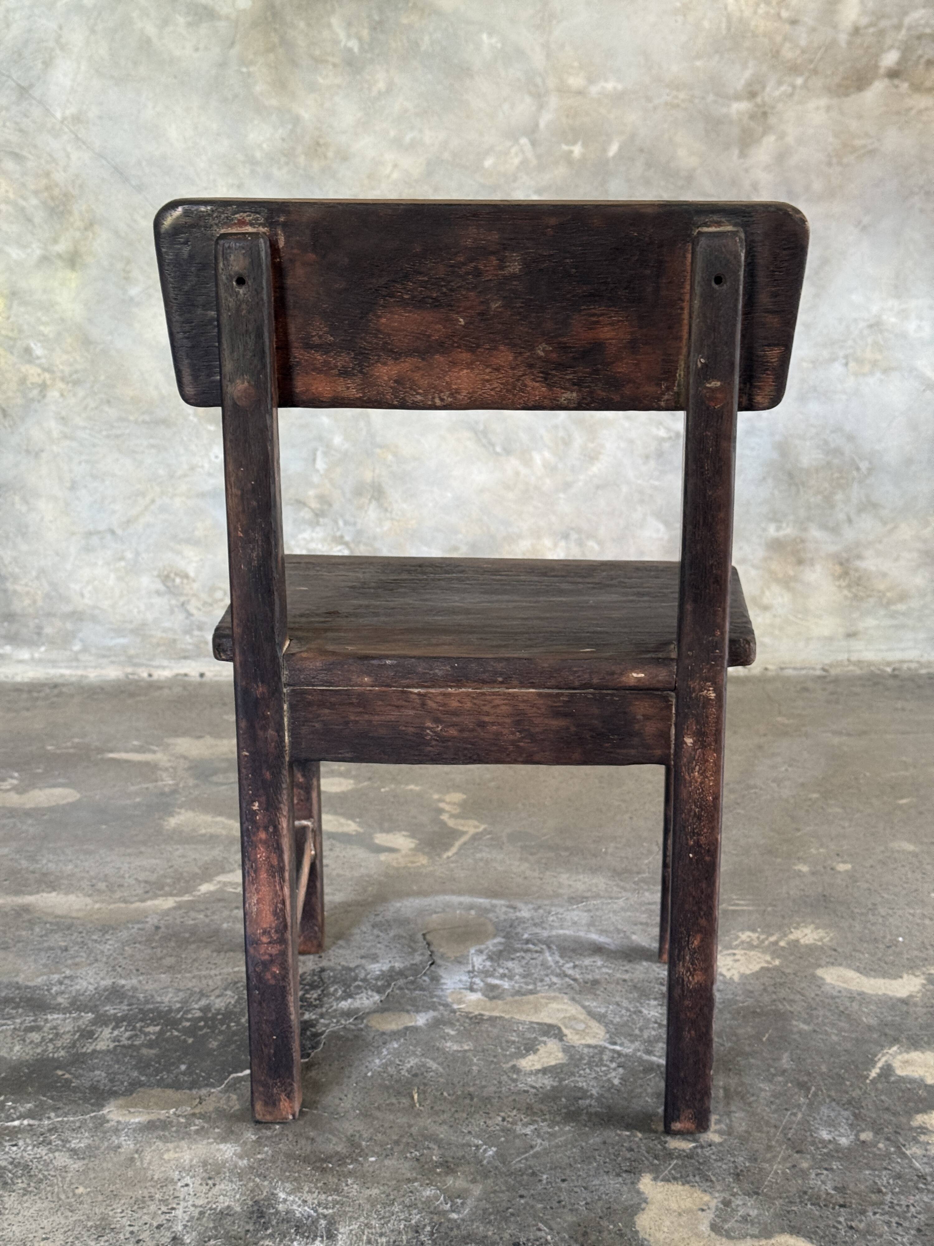 Small antique Indonesian children's chair in teak.