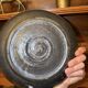 Stoneware plate signed J. Brisy