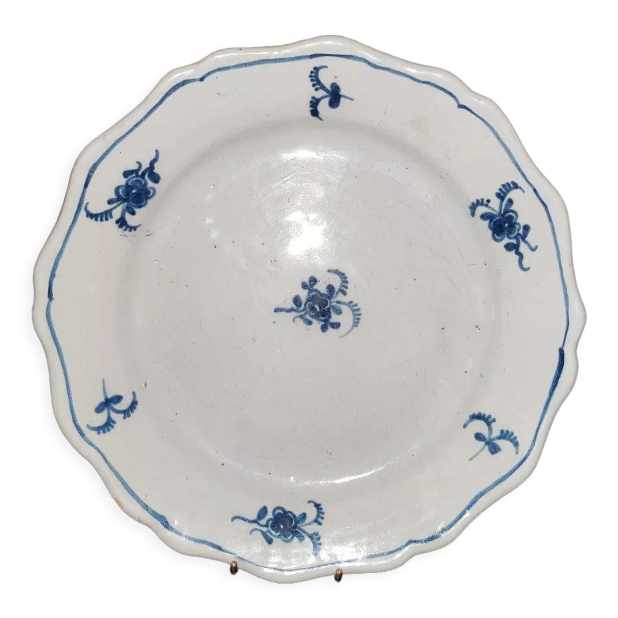 Old plate in Northern earthenware with blue floral decoration eighteenth century