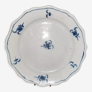 Old plate in Northern earthenware with blue floral decoration eighteenth century