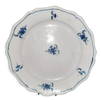 Old plate in Northern earthenware with blue floral decoration eighteenth century