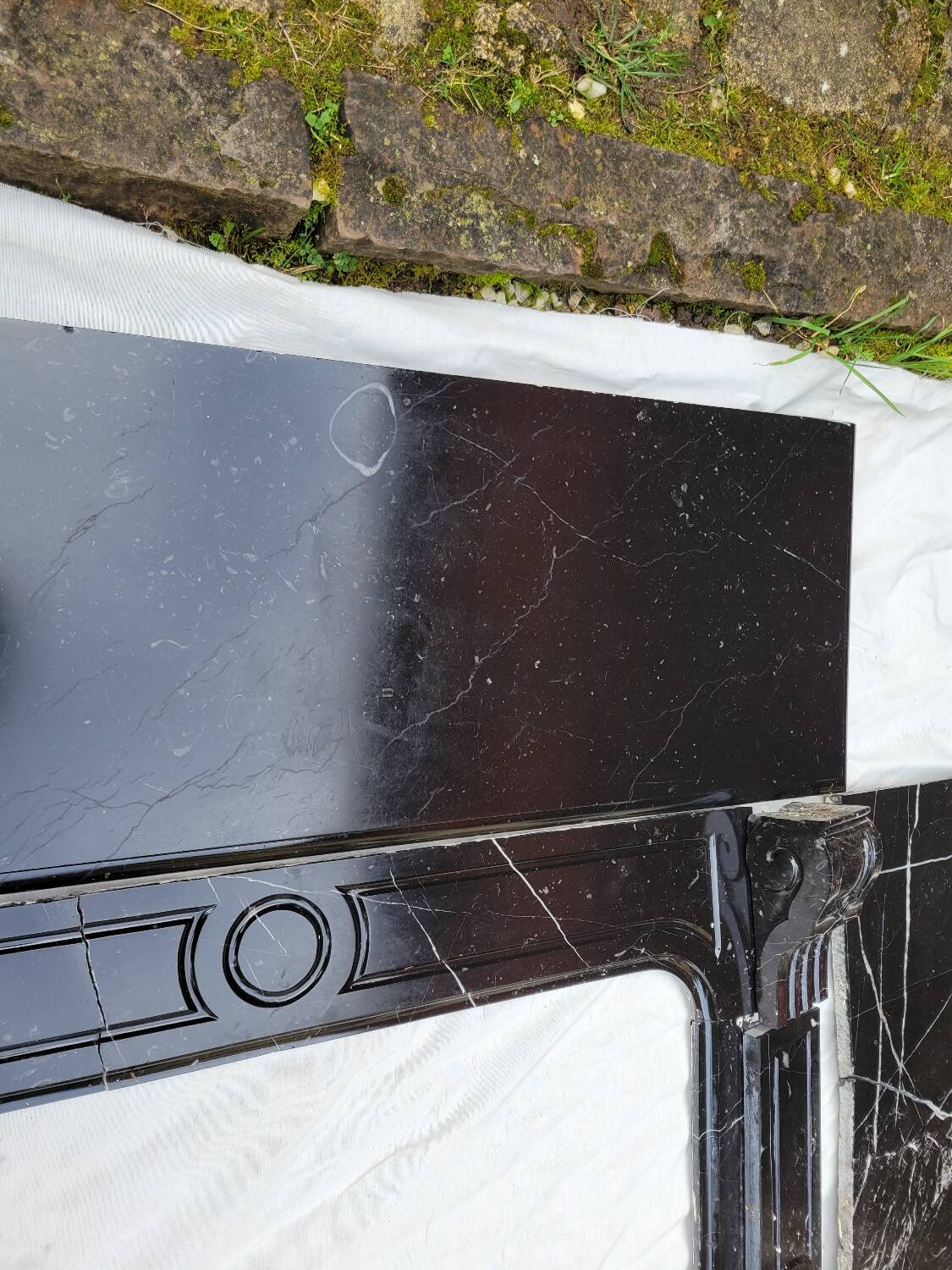 Pompadour fireplace with black marble modillions
