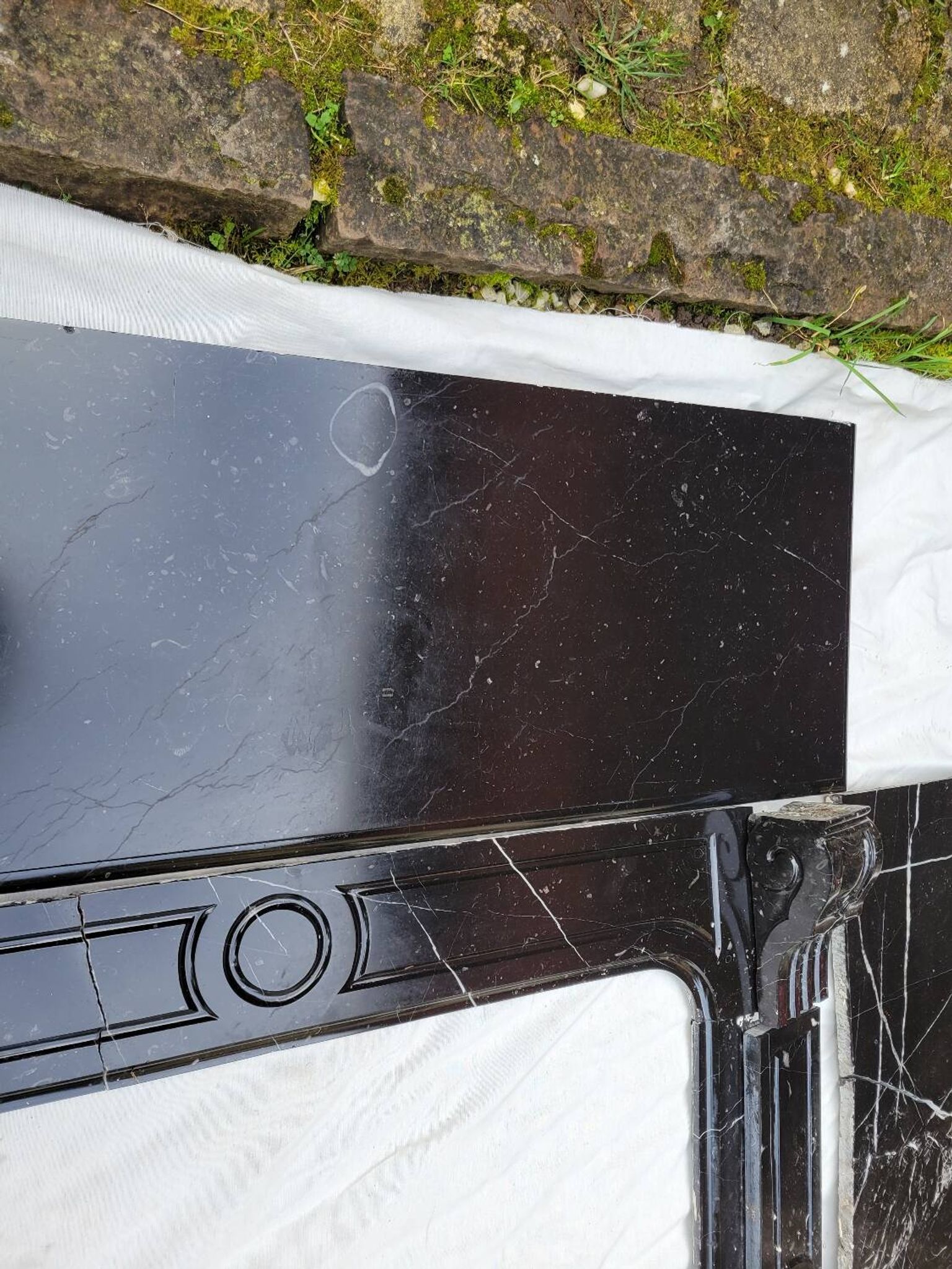 Pompadour fireplace with black marble modillions