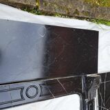 Pompadour fireplace with black marble modillions