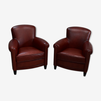 Paire de fauteuils club en cuir de mouton