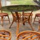 Vintage rattan dining set with glass table, 4 chairs and 4 stools.