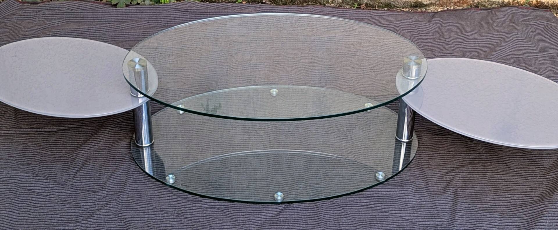 Coffee table with rotating glass tops by Antoine Motard.