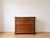 Antique solid wood chest of drawers with four drawers.