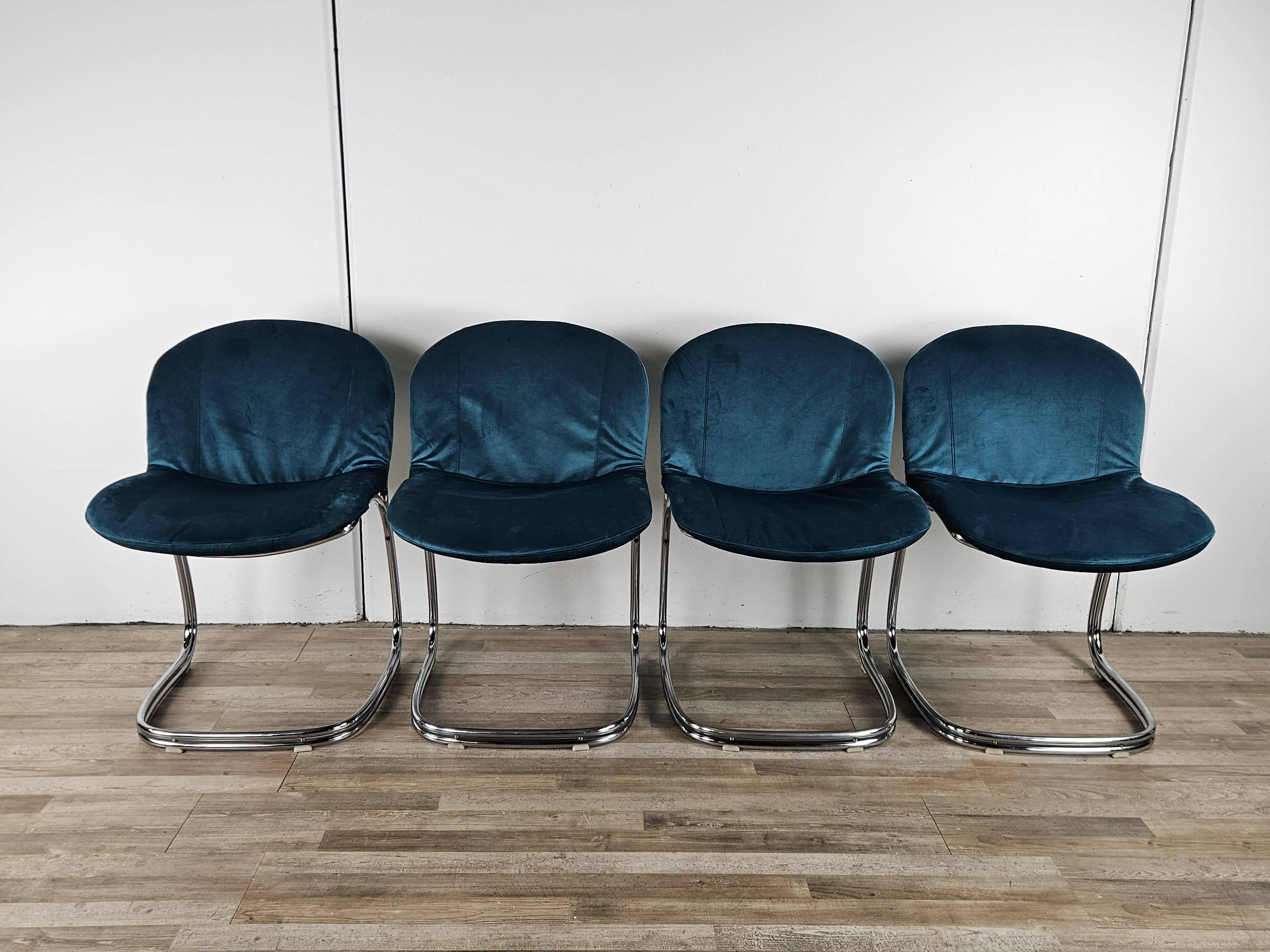 Four 1970s tubular chairs upholstered in blue velvet