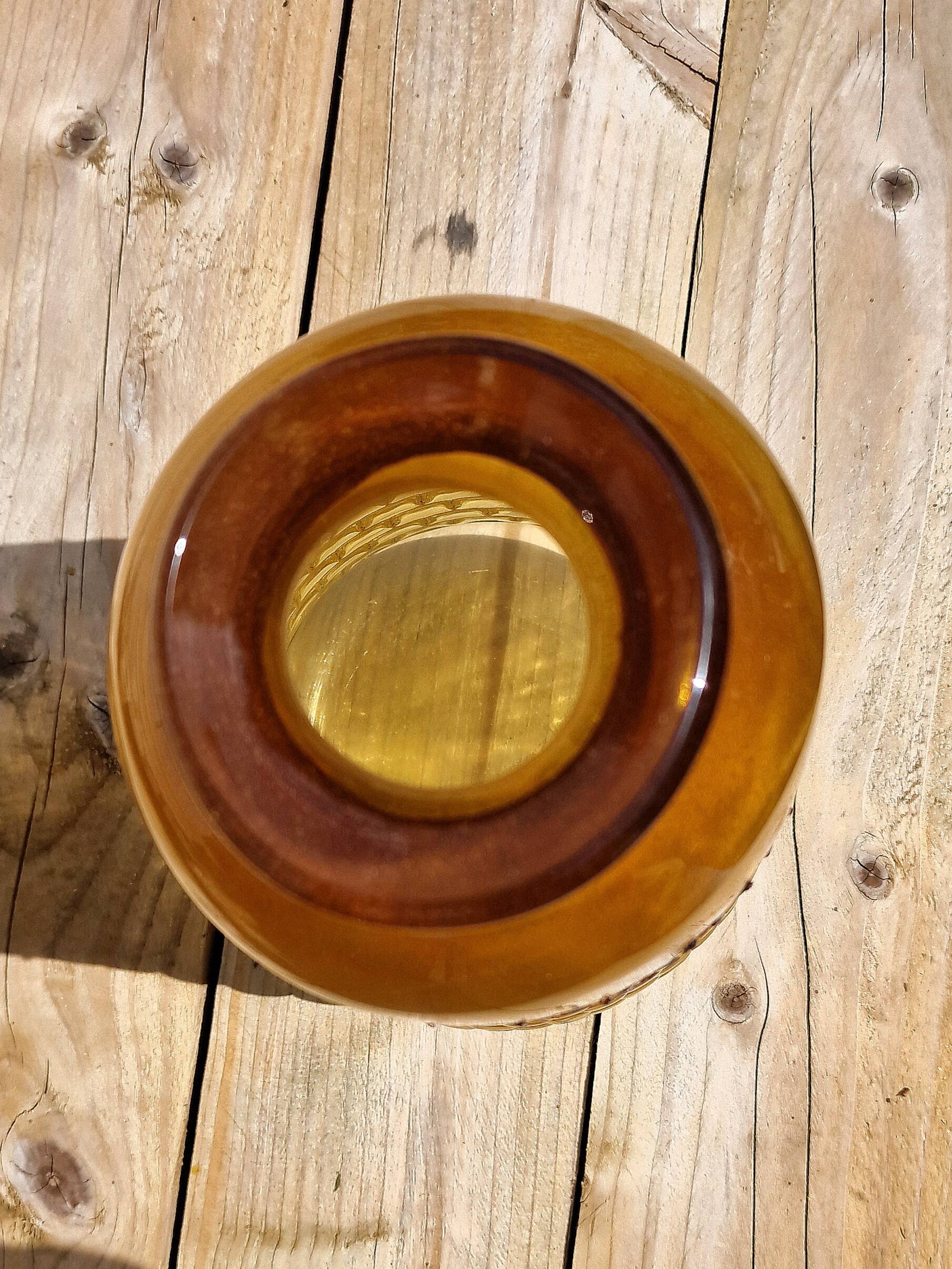 Artisanal blown amber glass vase with integrated honeycomb structure.