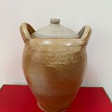 Ancient jar in varnished sandstone