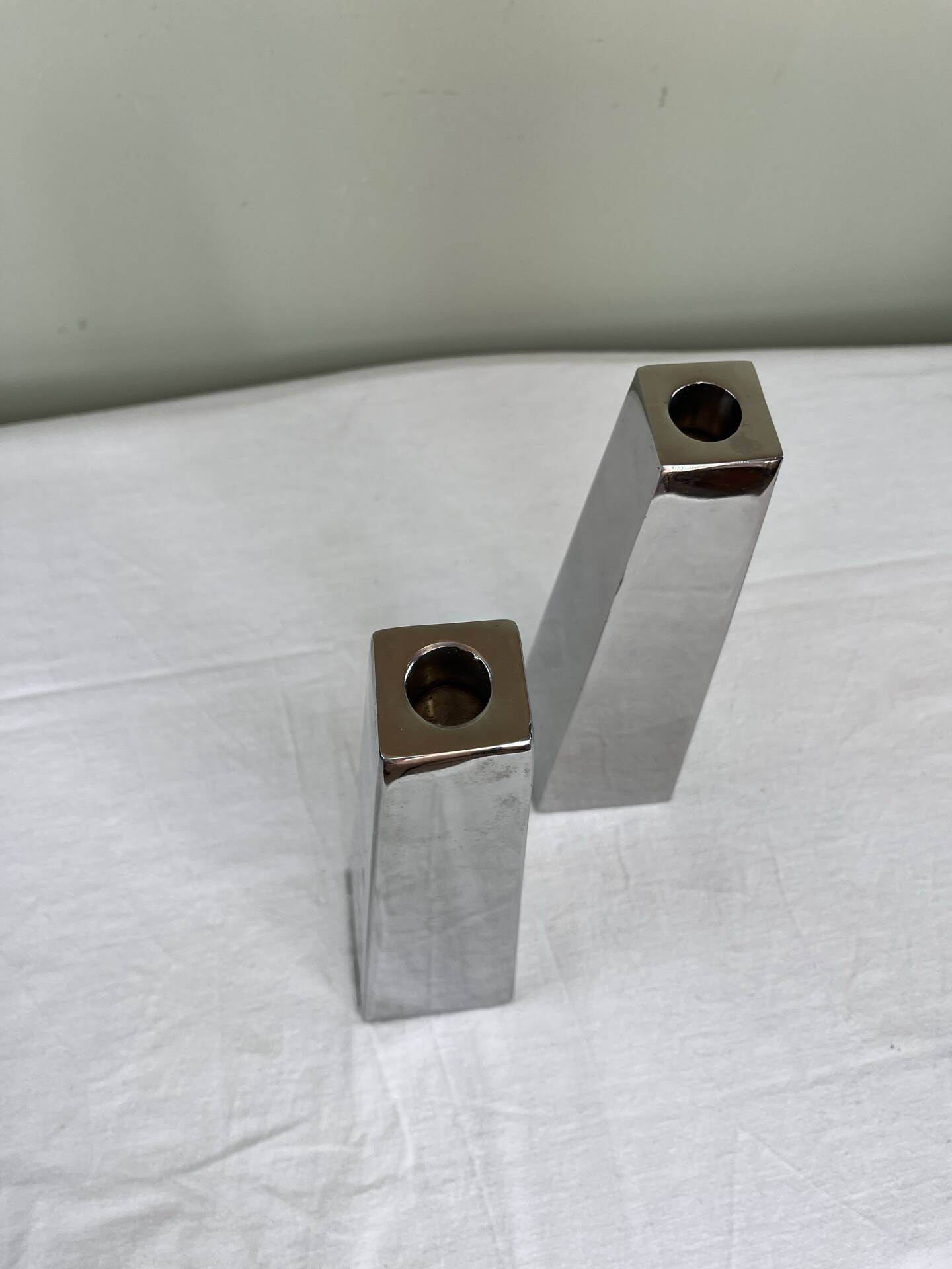 Pair of chrome metal candlesticks