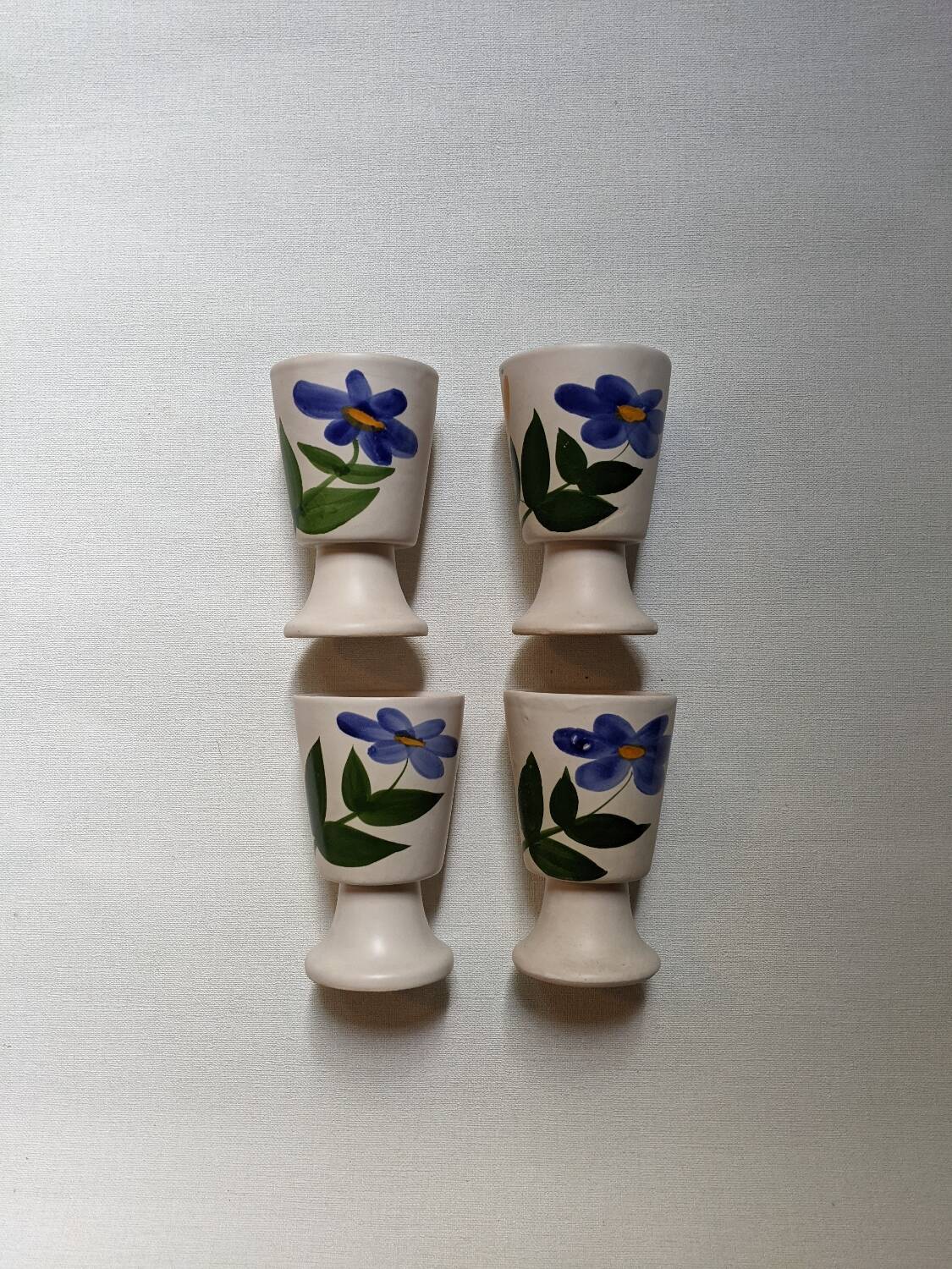 Ceramic mazagran with hand-painted floral decoration.
