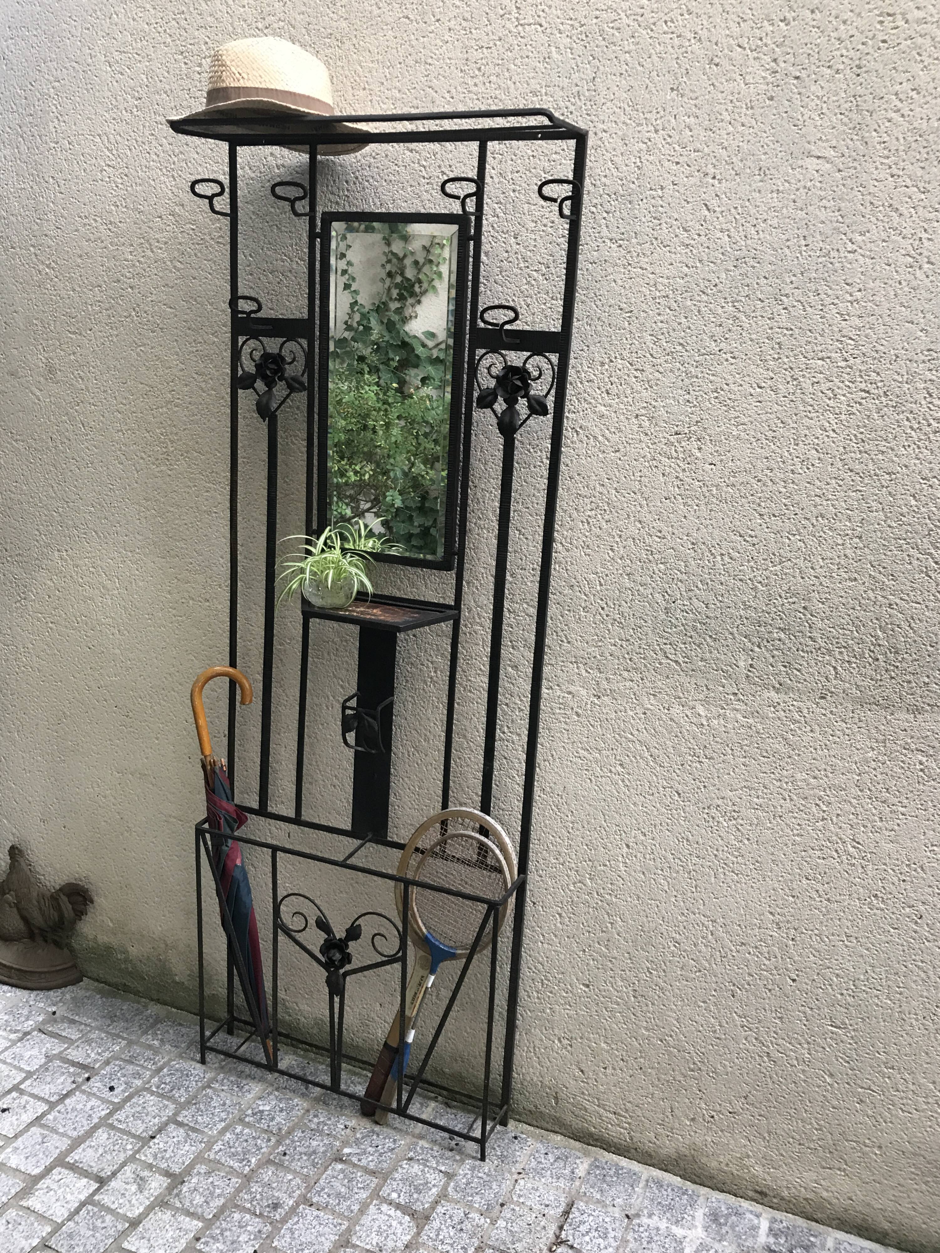 Wrought iron coat holder with 1930