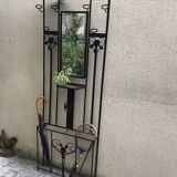 Wrought iron coat holder with 1930