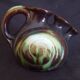 Vase with 3 flowers in the shape of a ceramic snail from Thulin (Belgium)