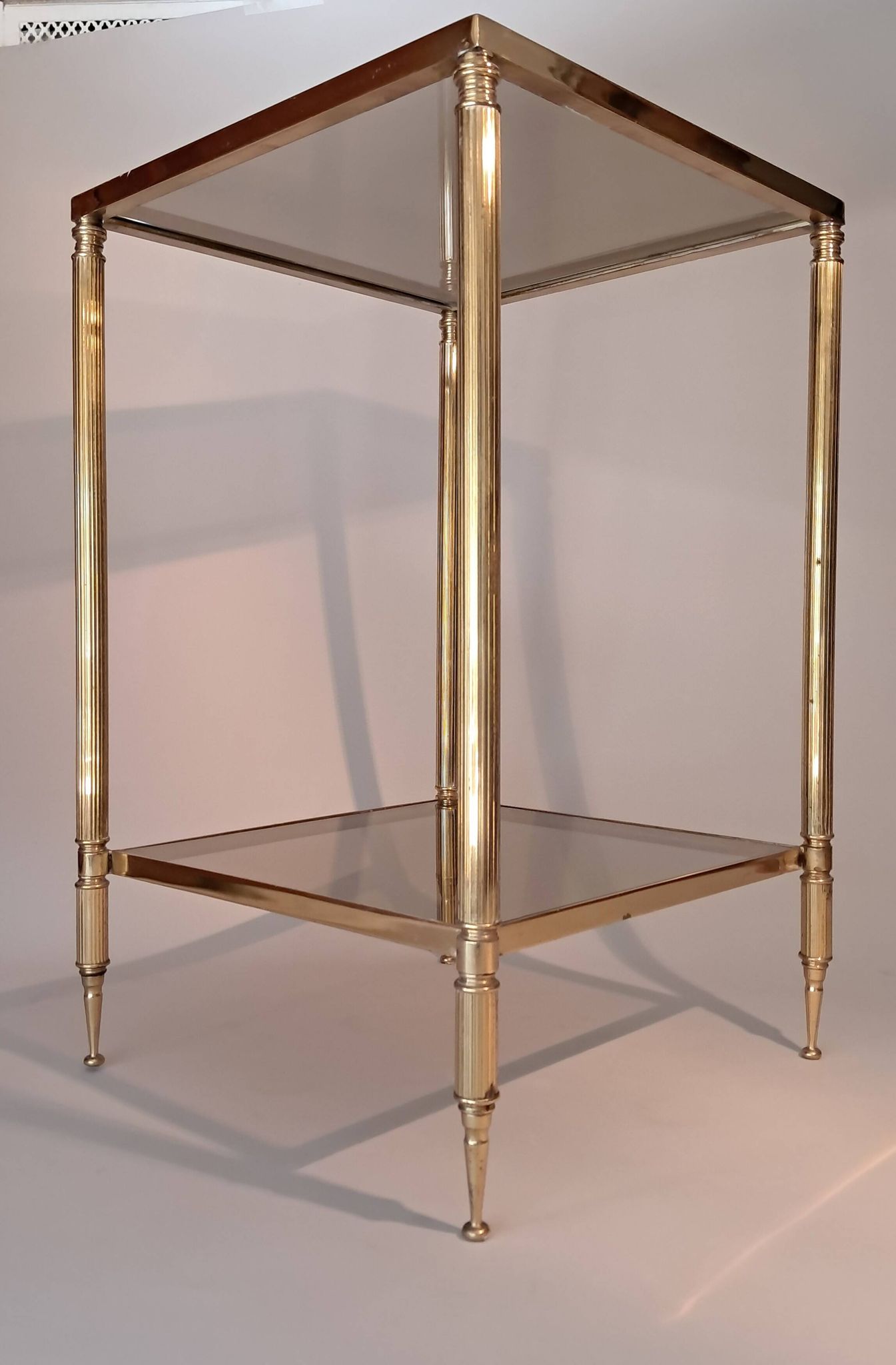 Gilded brass and smoked glass end table, 1960s.
