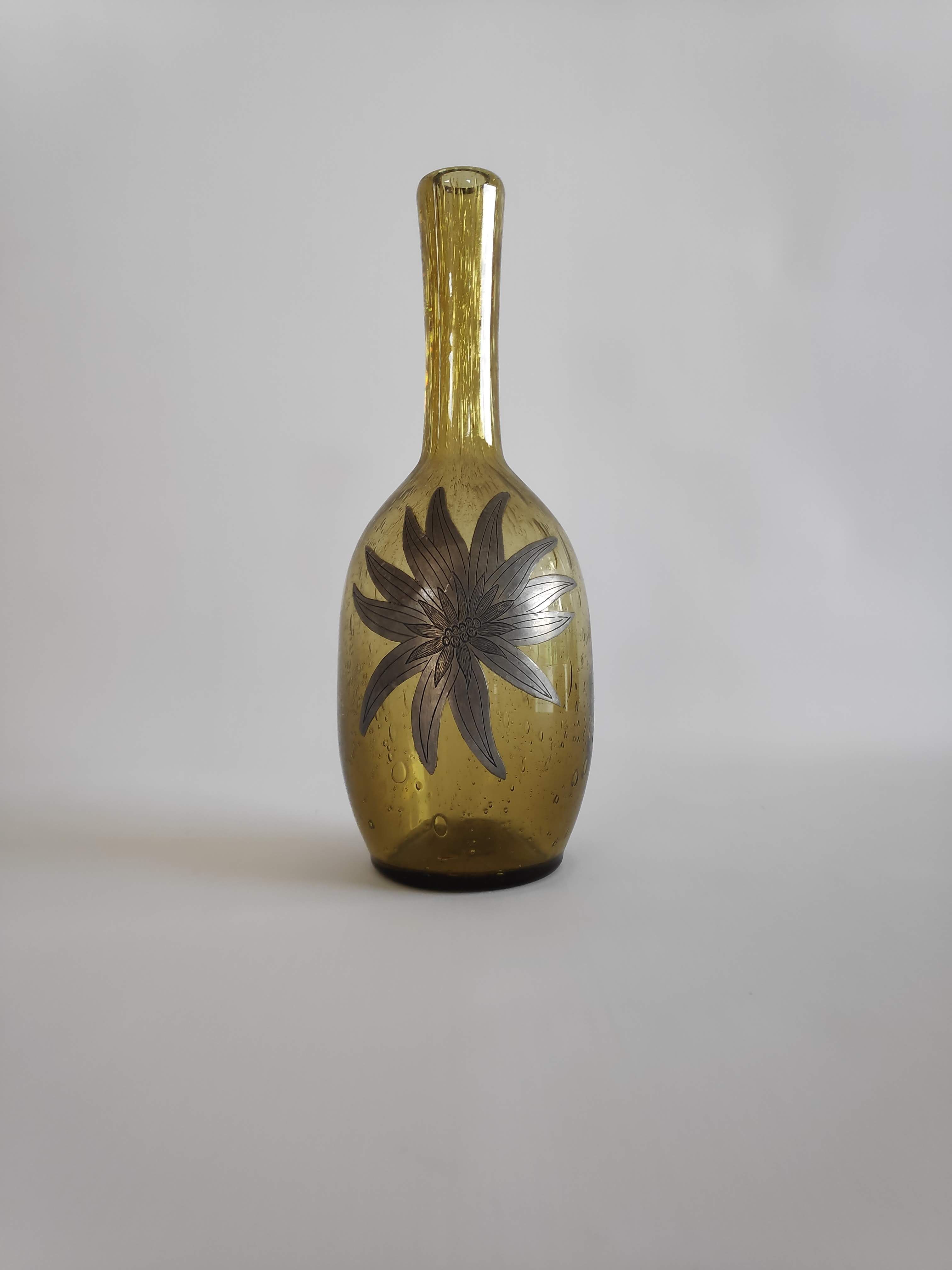 50-year-old soliflora vase in green bulled glass and pewter flower