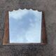Art Deco mirror with carved wood, featuring floral motifs from the 1930s.