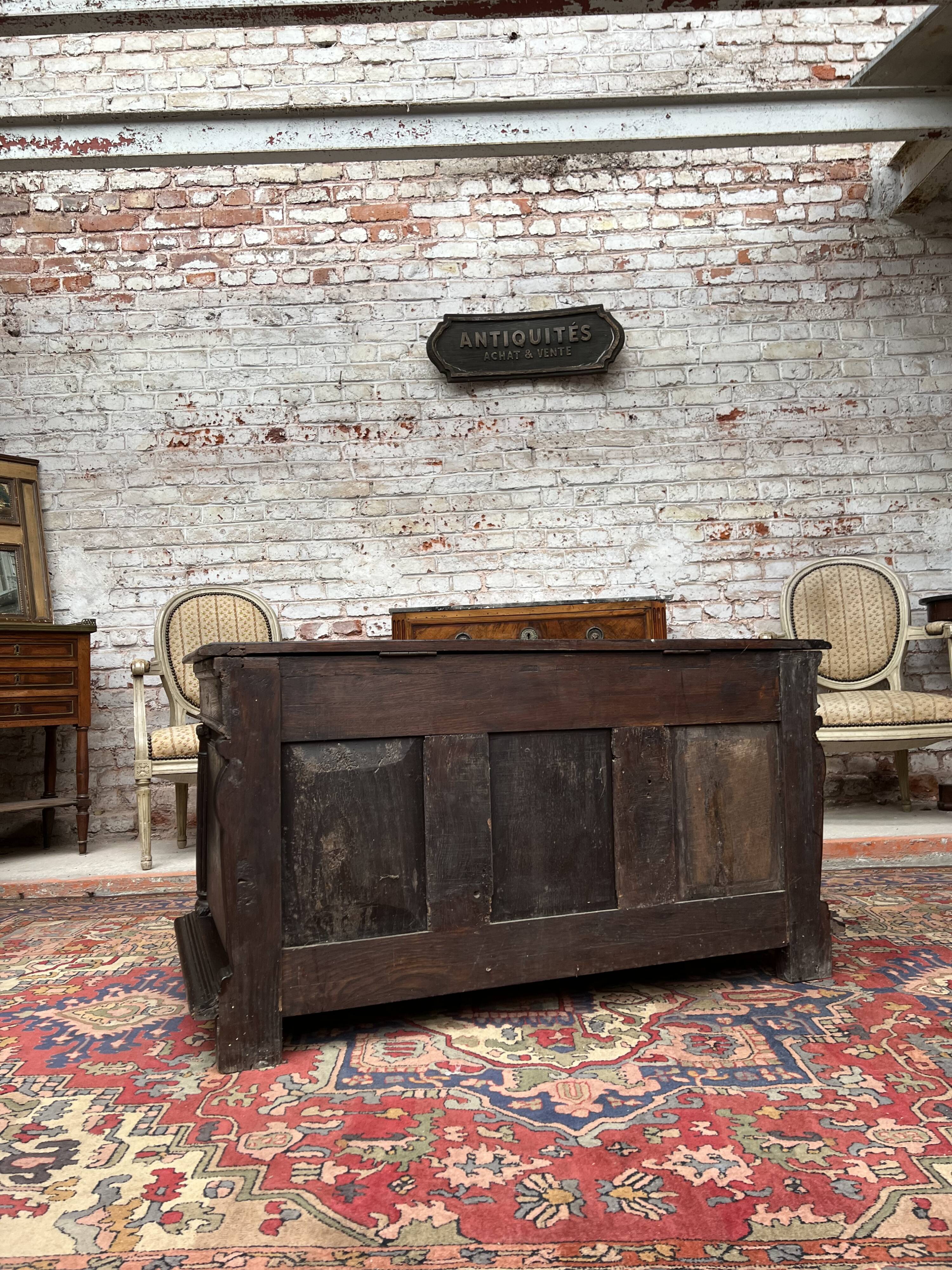 Chest in carved natural wood of the eighteenth century