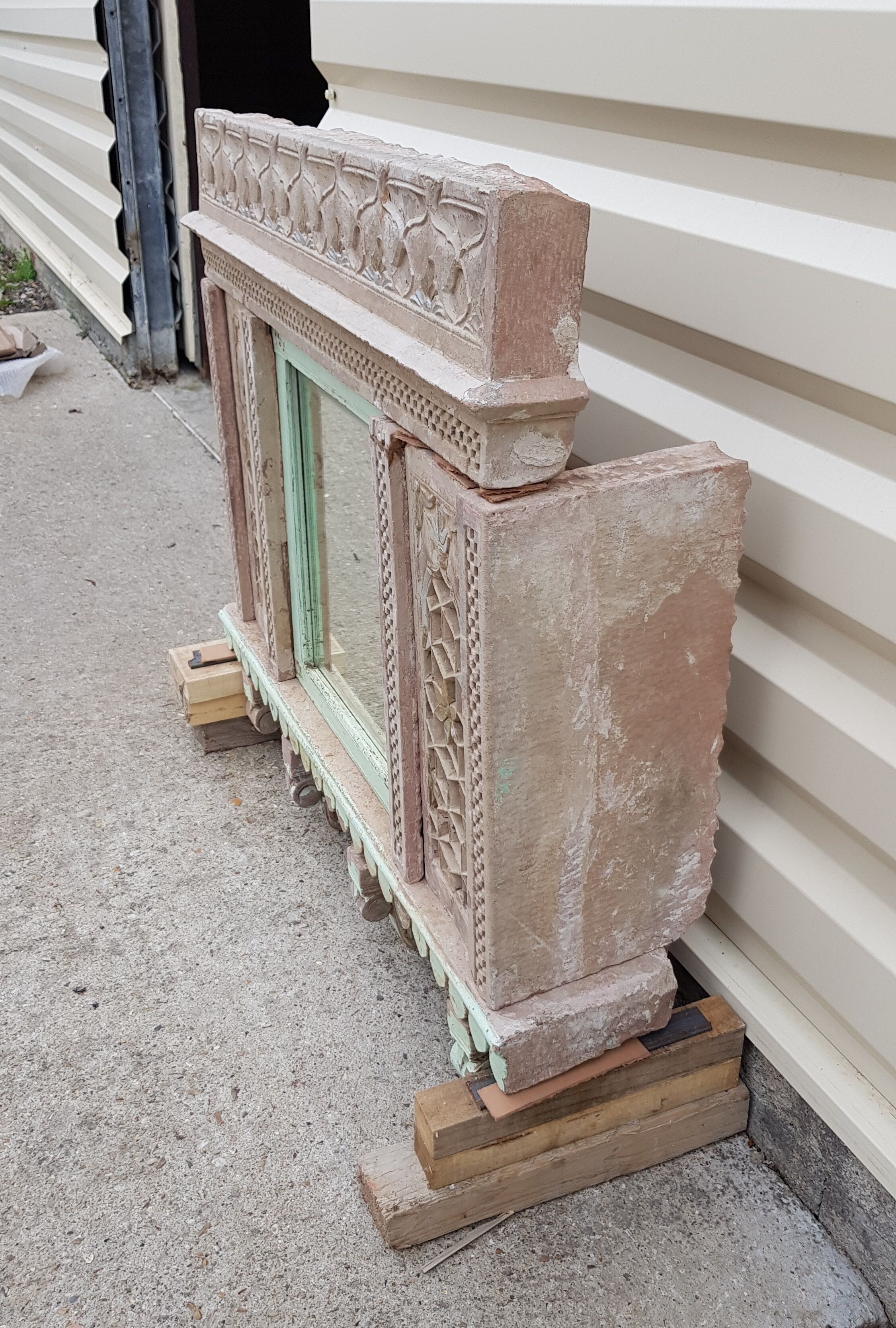 Fully hand-carved stone window with mirror