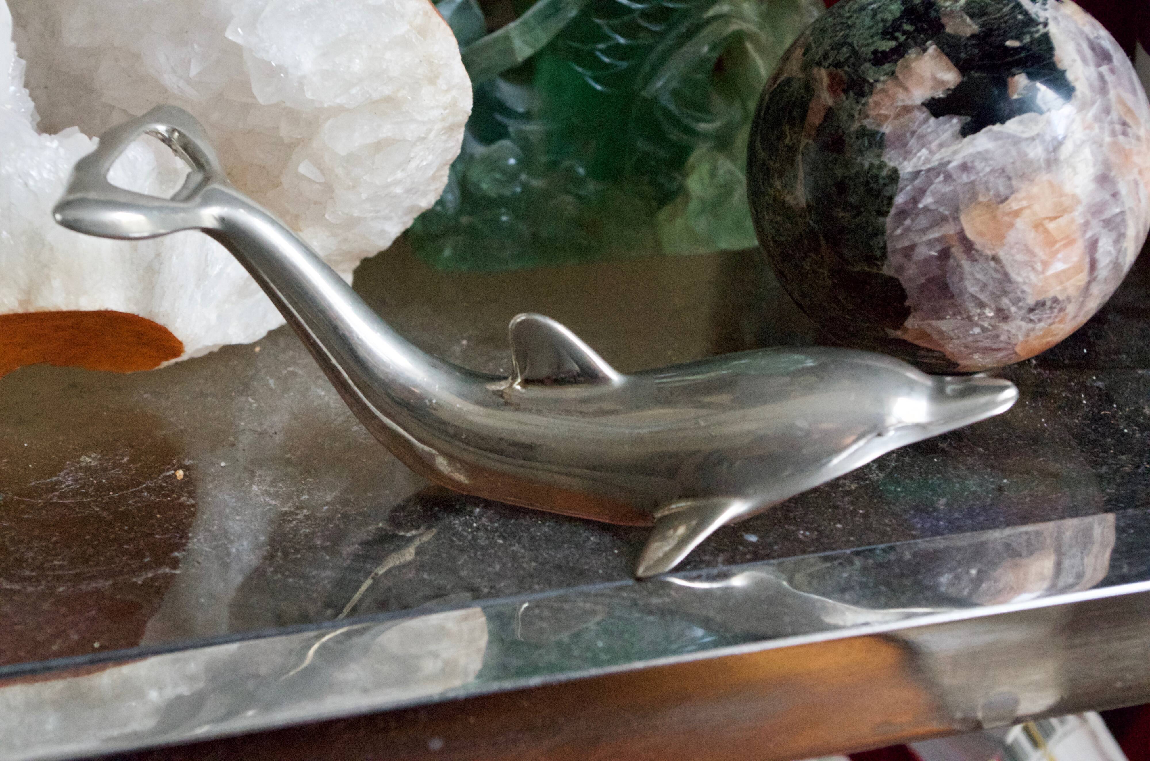 Vintage metal bottle opener dolphin