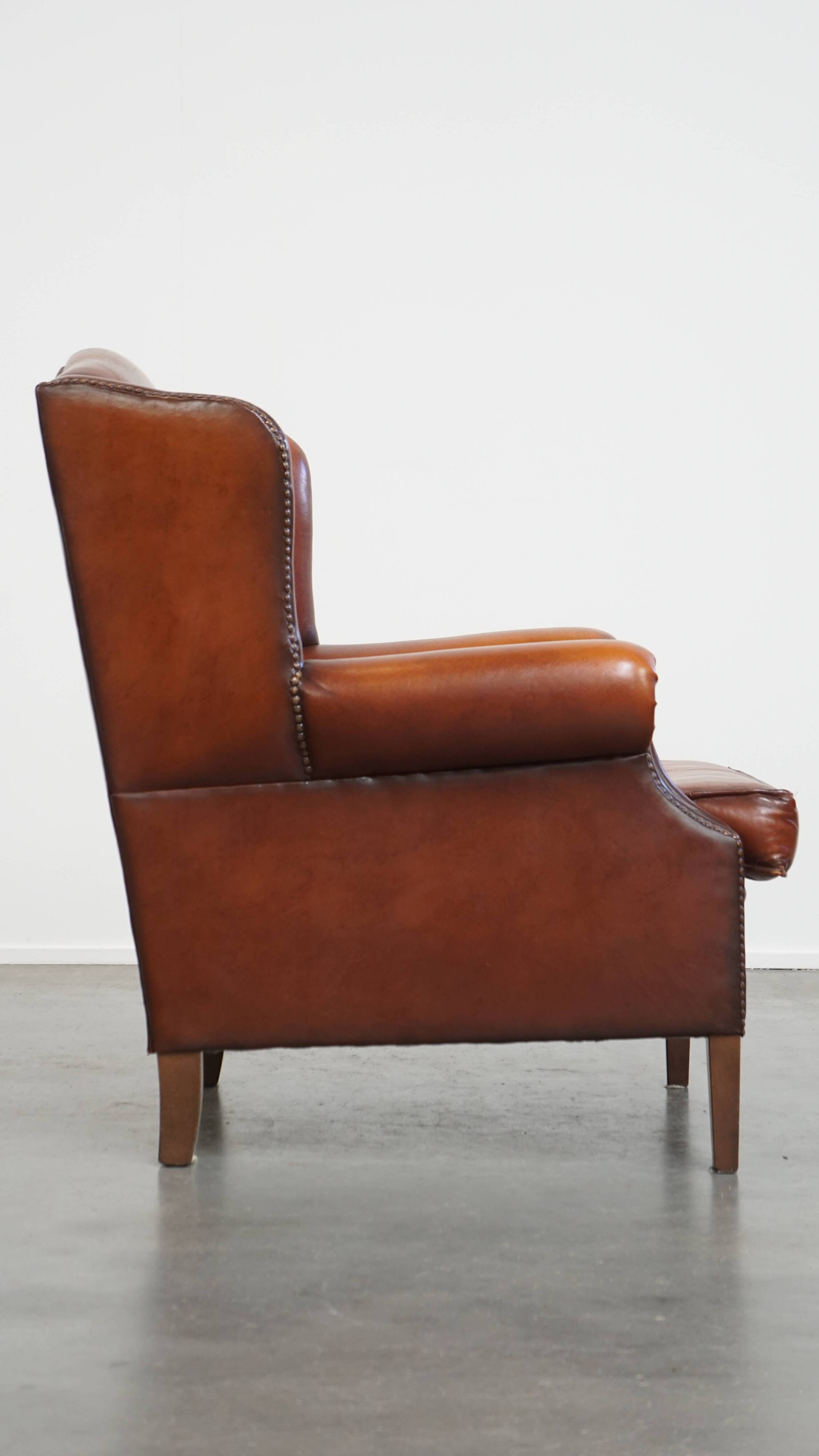 Fauteuil à oreilles en cuir de mouton