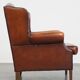 Fauteuil à oreilles en cuir de mouton