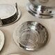 Silver coaster and holder, shell, 80s