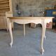 Round table made of cherry wood, sanded and varnished.