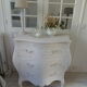 Curved patinated chest of drawers pearl grey waxed finish