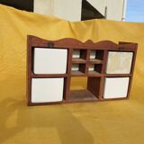 Vintage wooden spice rack with ceramic drawers