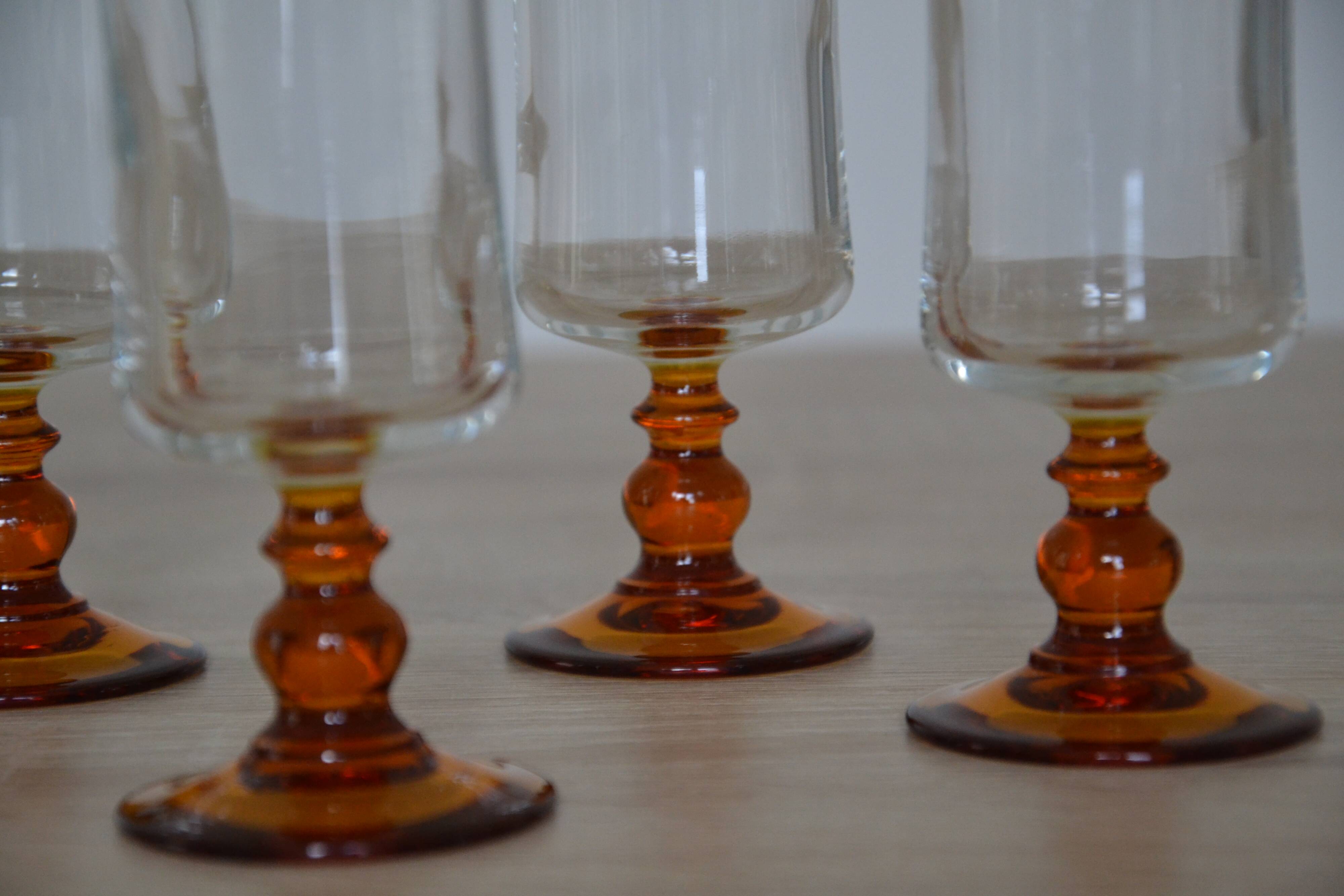 Champagne glasses with amber stems