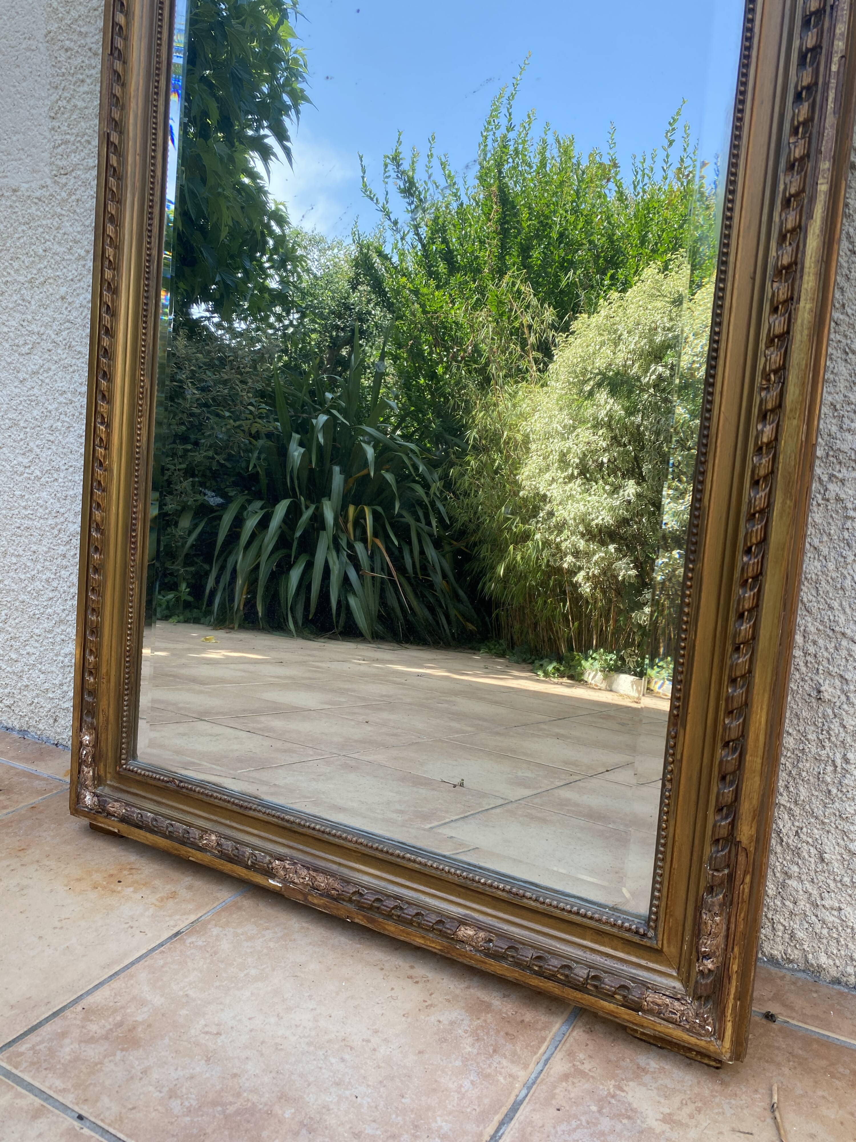 19th century Louis XVI style mirror in wood gilded with gold leaf, 74x150cm
