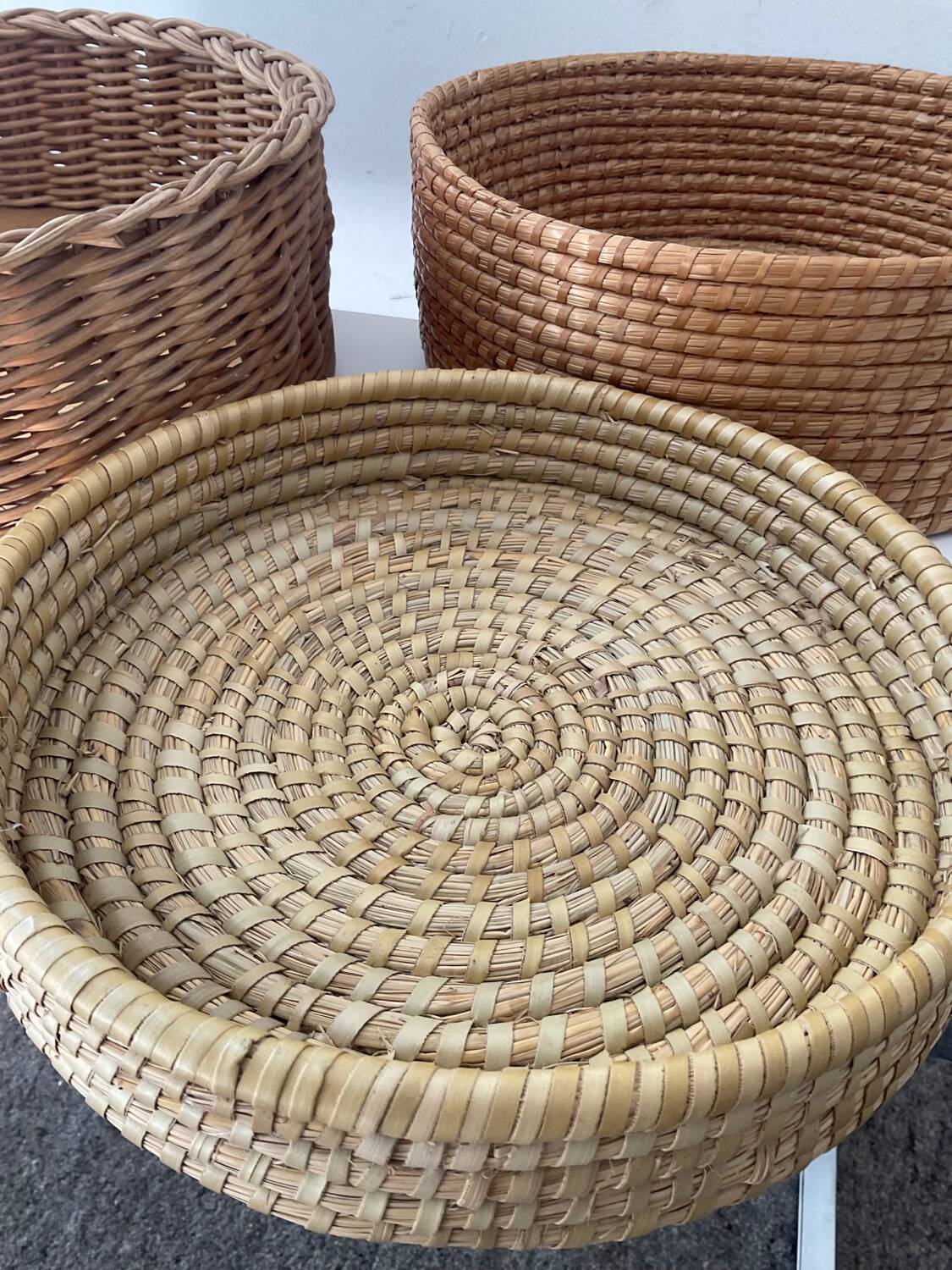 Trio of vintage wicker and woven raffia baskets