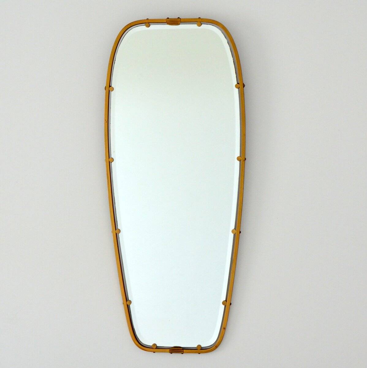 Superb free-form mirror in solid brass from the 50s/60s vintage.