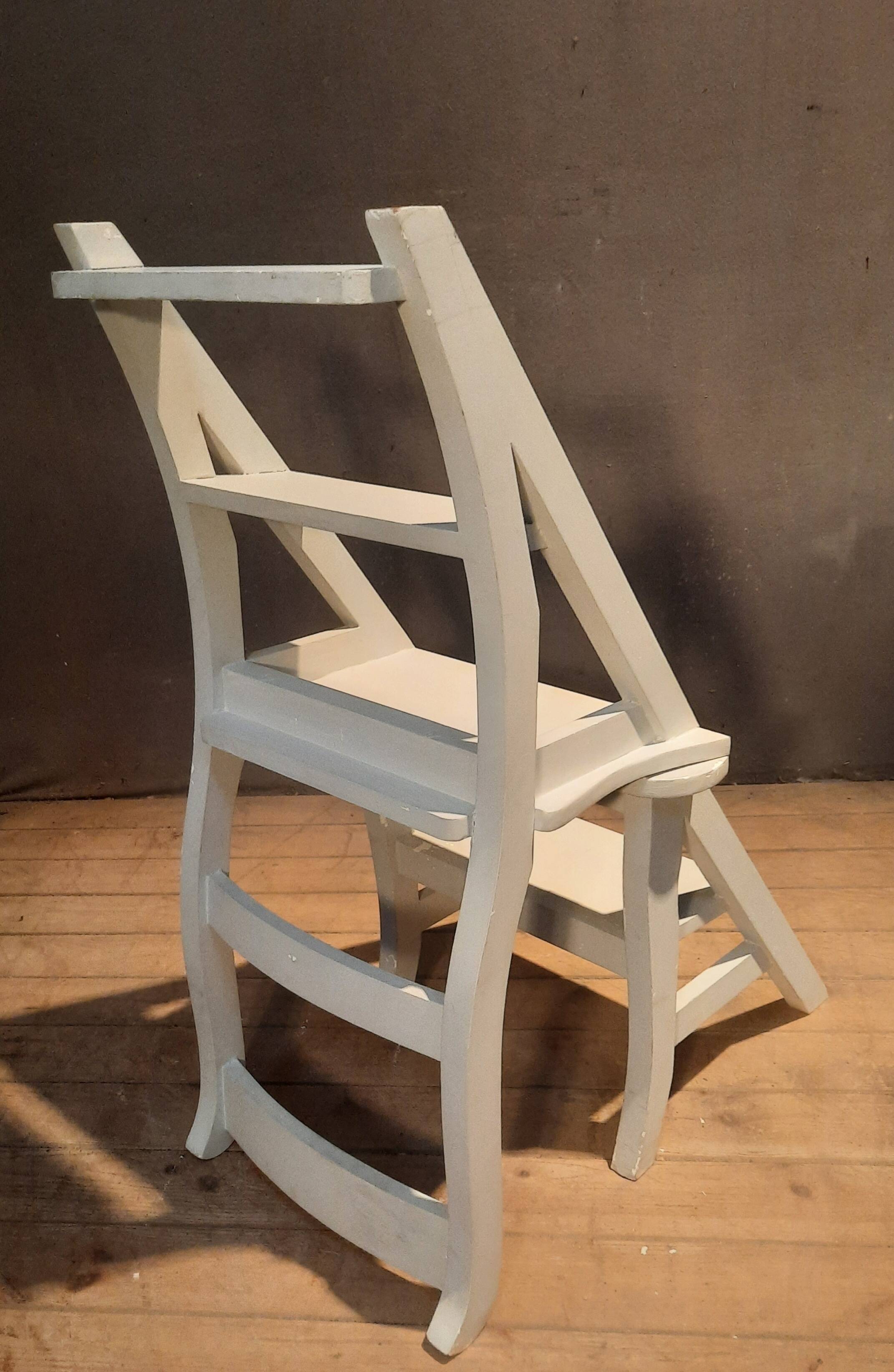 White chair convertible into a staircase.