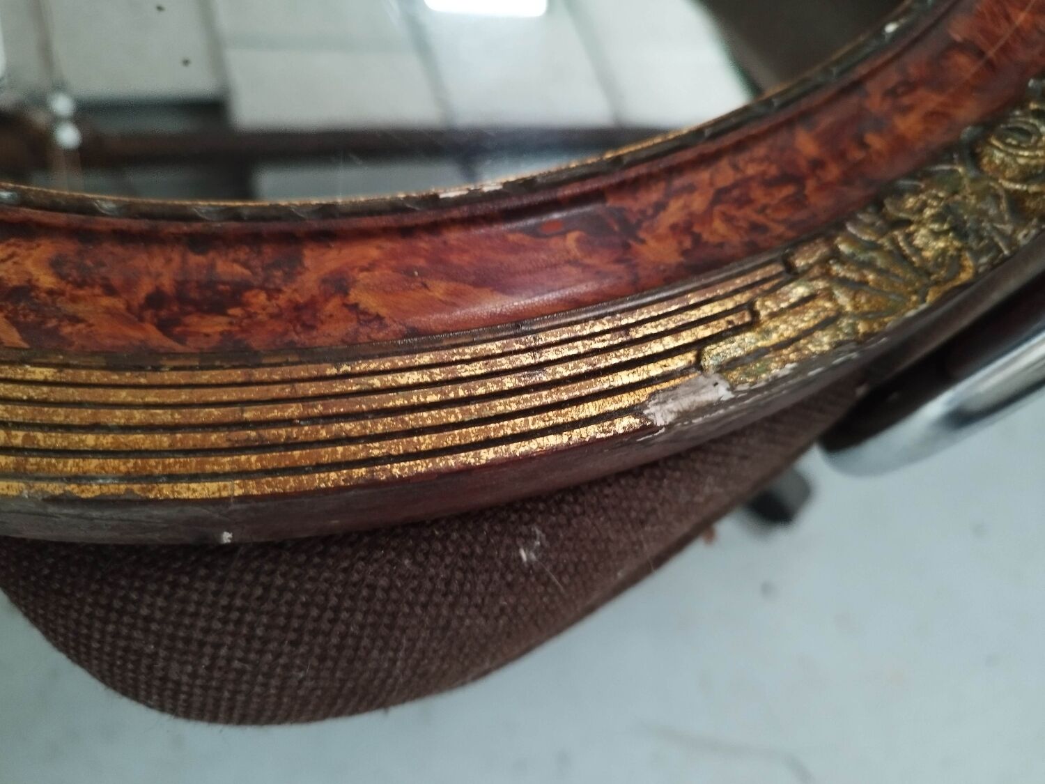 Golden oval art deco mirror