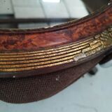 Golden oval art deco mirror