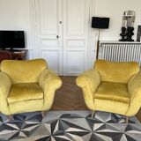 A pair of 1920s armchairs with an ottoman. Good condition.