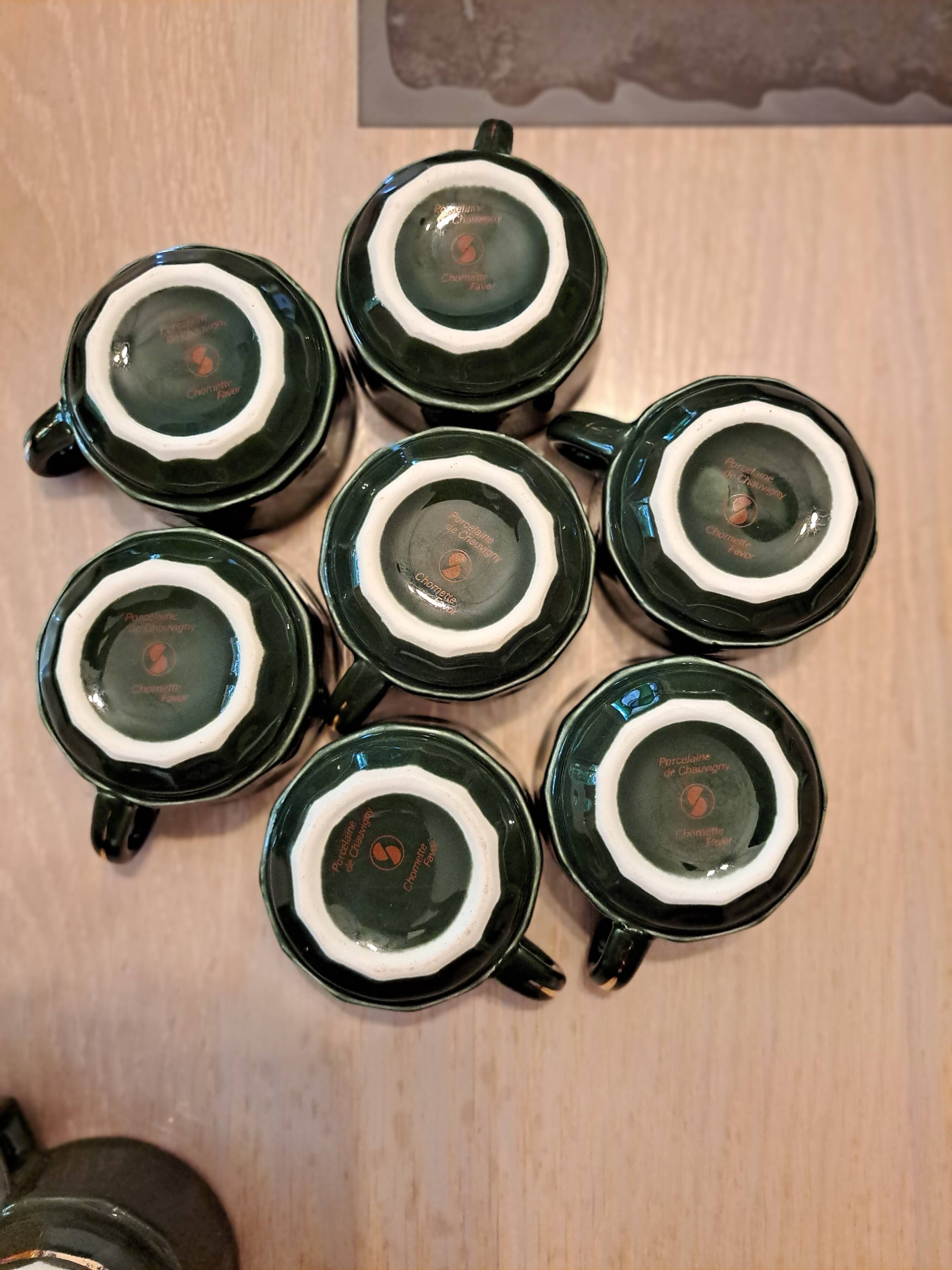 Green and gold coffee cups and sub-cups