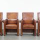 Vintage set of 4 sheepskin leather dining chairs on castors