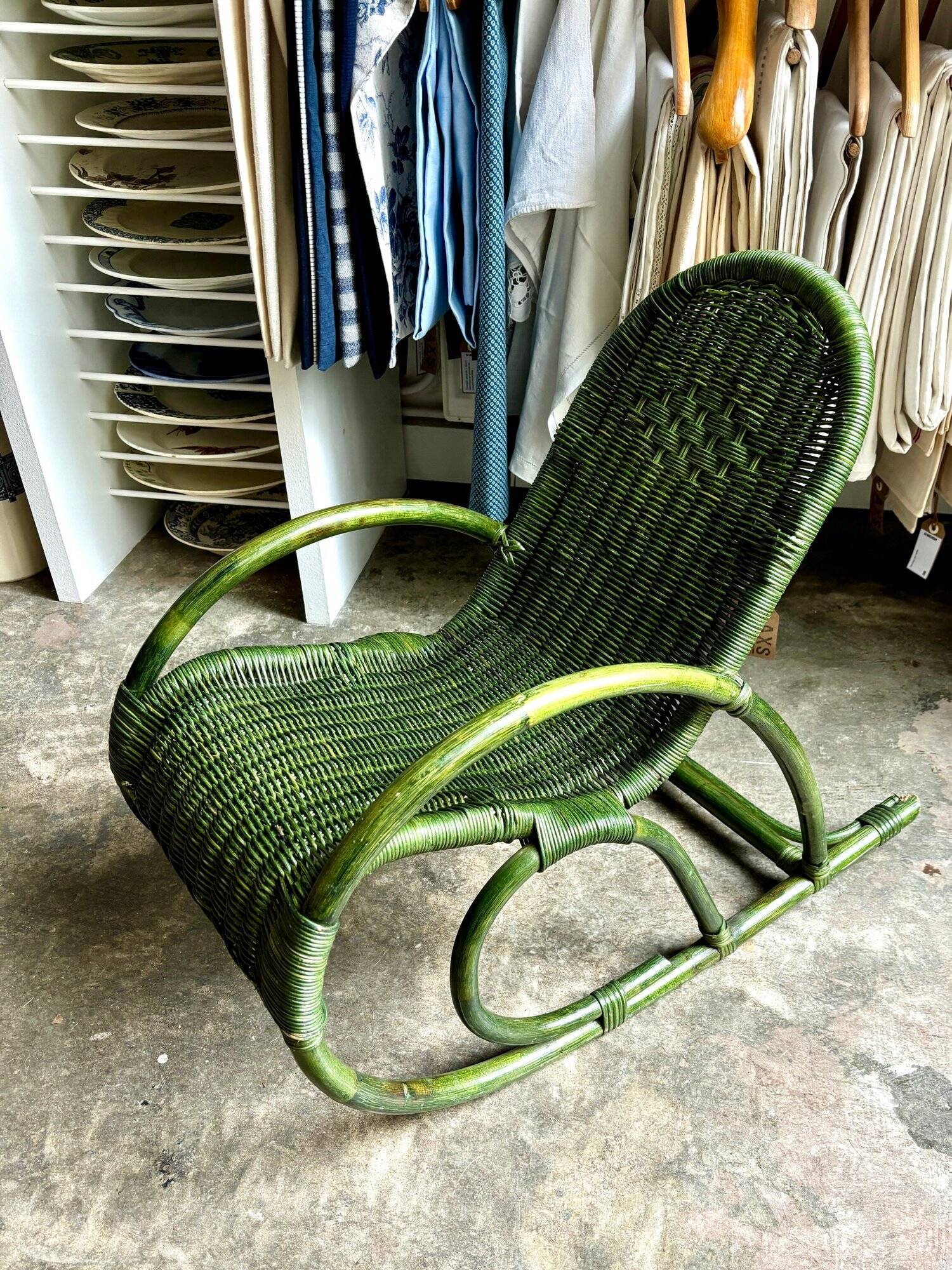Children's rocking chair in woven wicker and green rattan