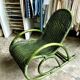 Children's rocking chair in woven wicker and green rattan