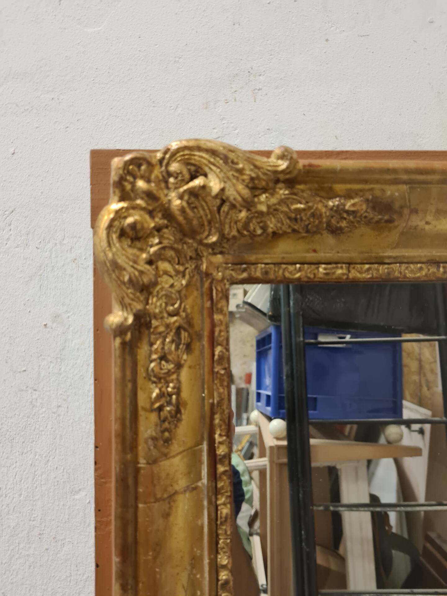 Antique gilded mirror, 19th century Empire style.